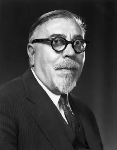 Formal portrait of older Wiener with white goatee and dark-rimmed glasses