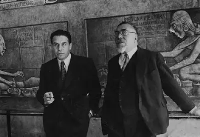 Wiener with colleague in front of Mexican medical history murals