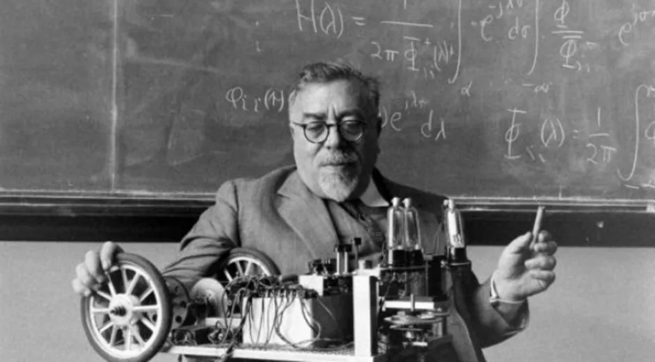 Norbert Wiener with his cybernetic robot and chalkboard equations at MIT