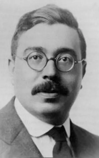 Young Norbert Wiener formal portrait with round glasses and mustache